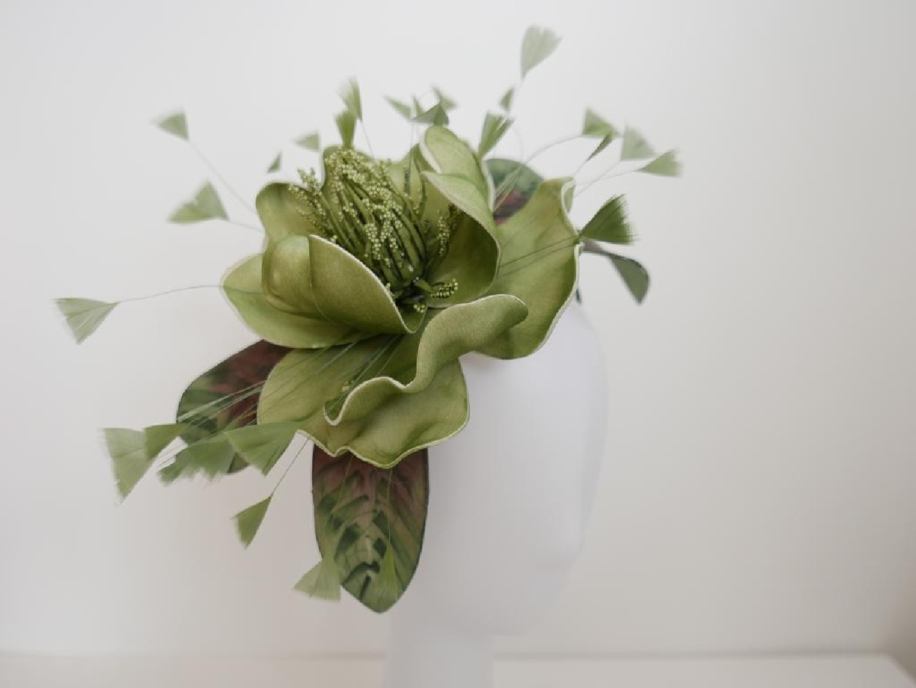 Zielony kwiat  fascynator  na opasce