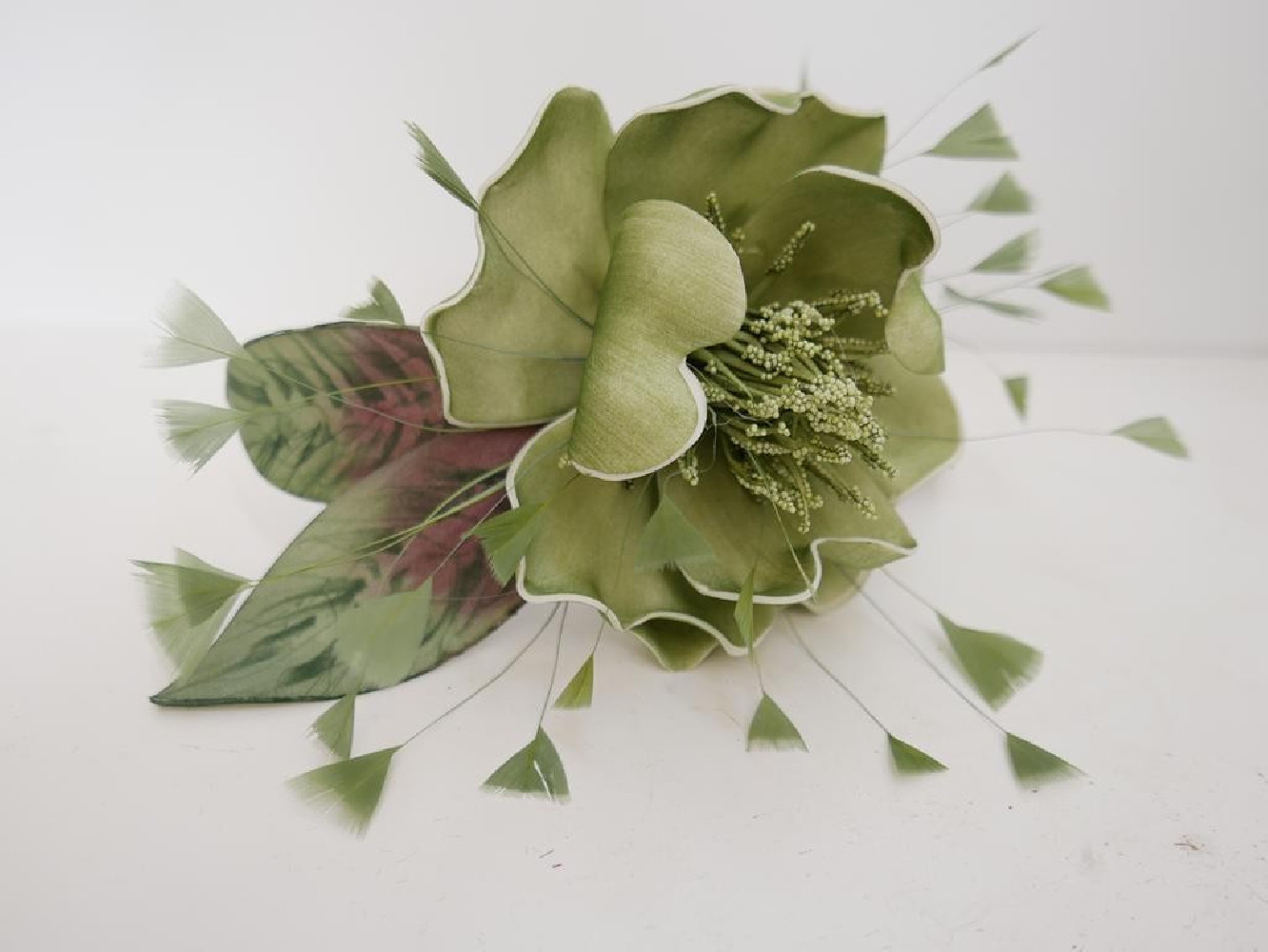 Zielony kwiat  fascynator  na opasce